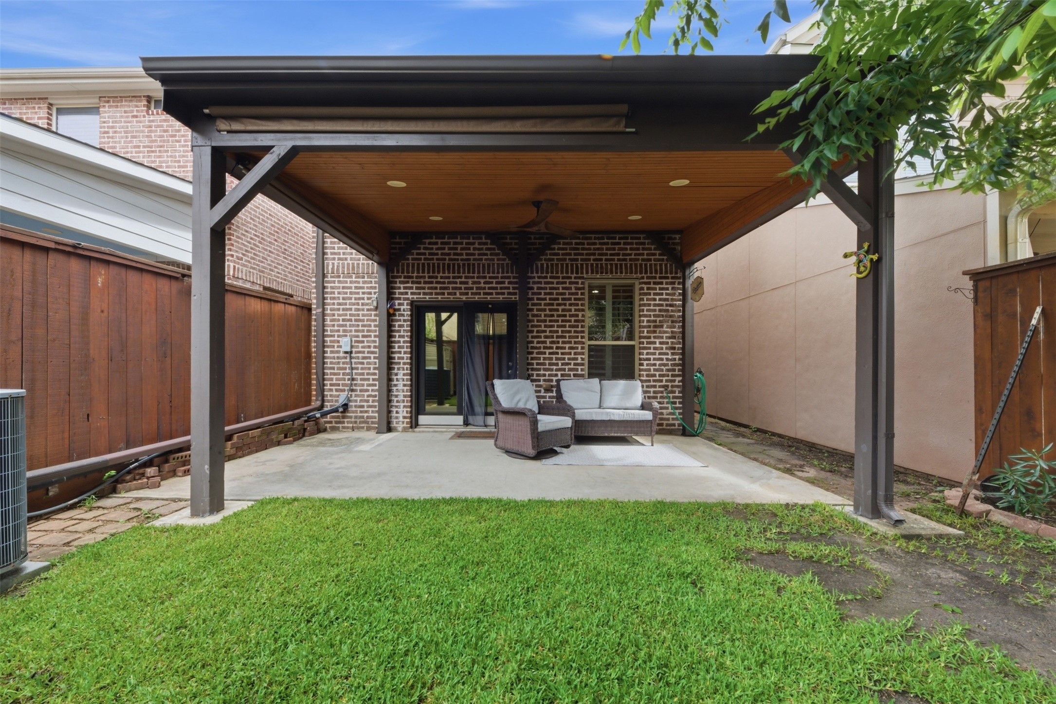 5929 Kansas Street Houston, TX 77007 - Photo 30 of 30 Backyard is great for summer evenings with covered patio & retractable shades.