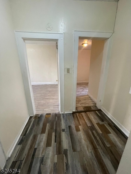 165 Augusta Street, Unit C8 Irvington, NJ 07111 - Photo 9 of 9 a view of a room with wooden floor and white walls