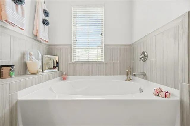 a bed room with a bed and a window