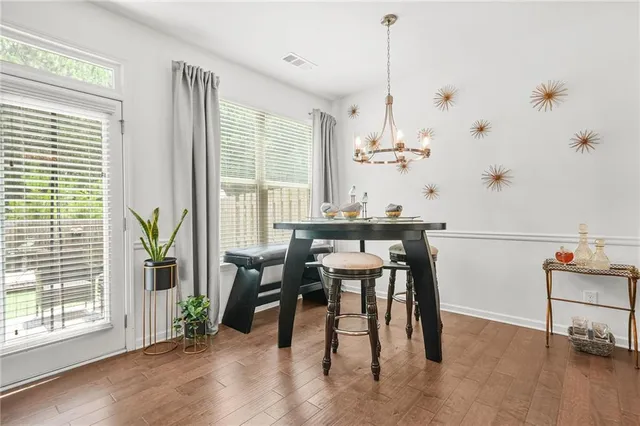 a kitchen with stainless steel appliances granite countertop a sink stove and microwave