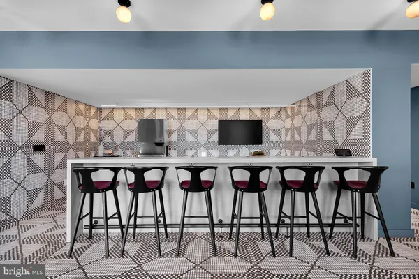 a view of a dining room with furniture and window