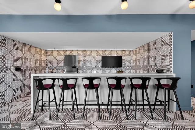 a view of a dining room with furniture and window