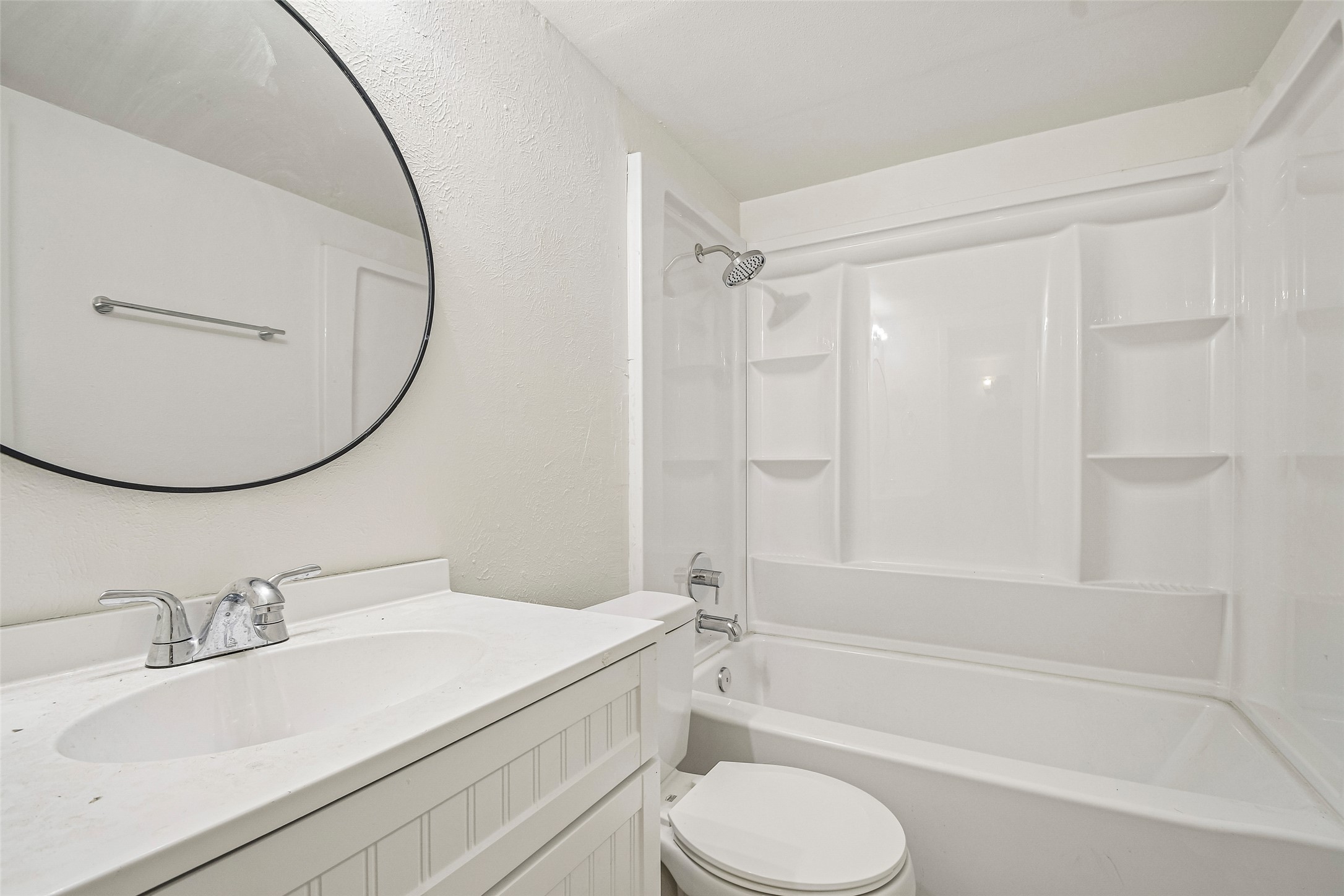 2413 Leon Street, Unit 104 Austin, TX 78705 - Photo 20 of 26 a bathroom with a granite countertop sink toilet and shower
