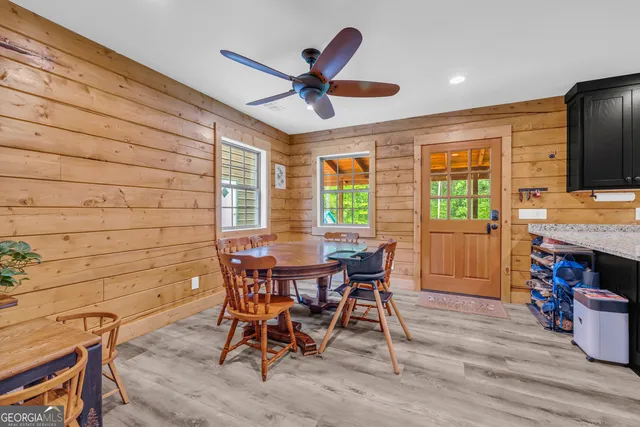 a view of a dining room with furniture window and outside view