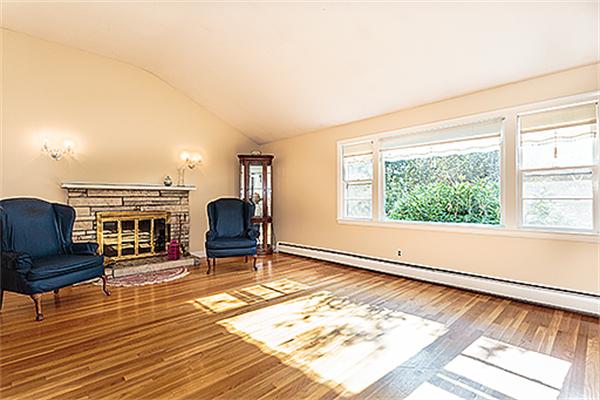 5 Trinity Road Winchester, MA 01890 - Photo 4 of 22 a living room with furniture and a fireplace