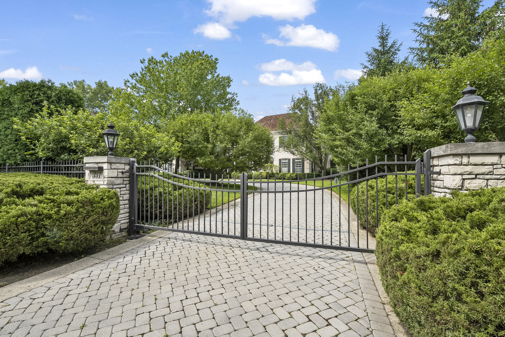 351 Wallace Road Lake Forest, IL 60045 - Photo 2 of 35 a view of a pathway with a wrought fence