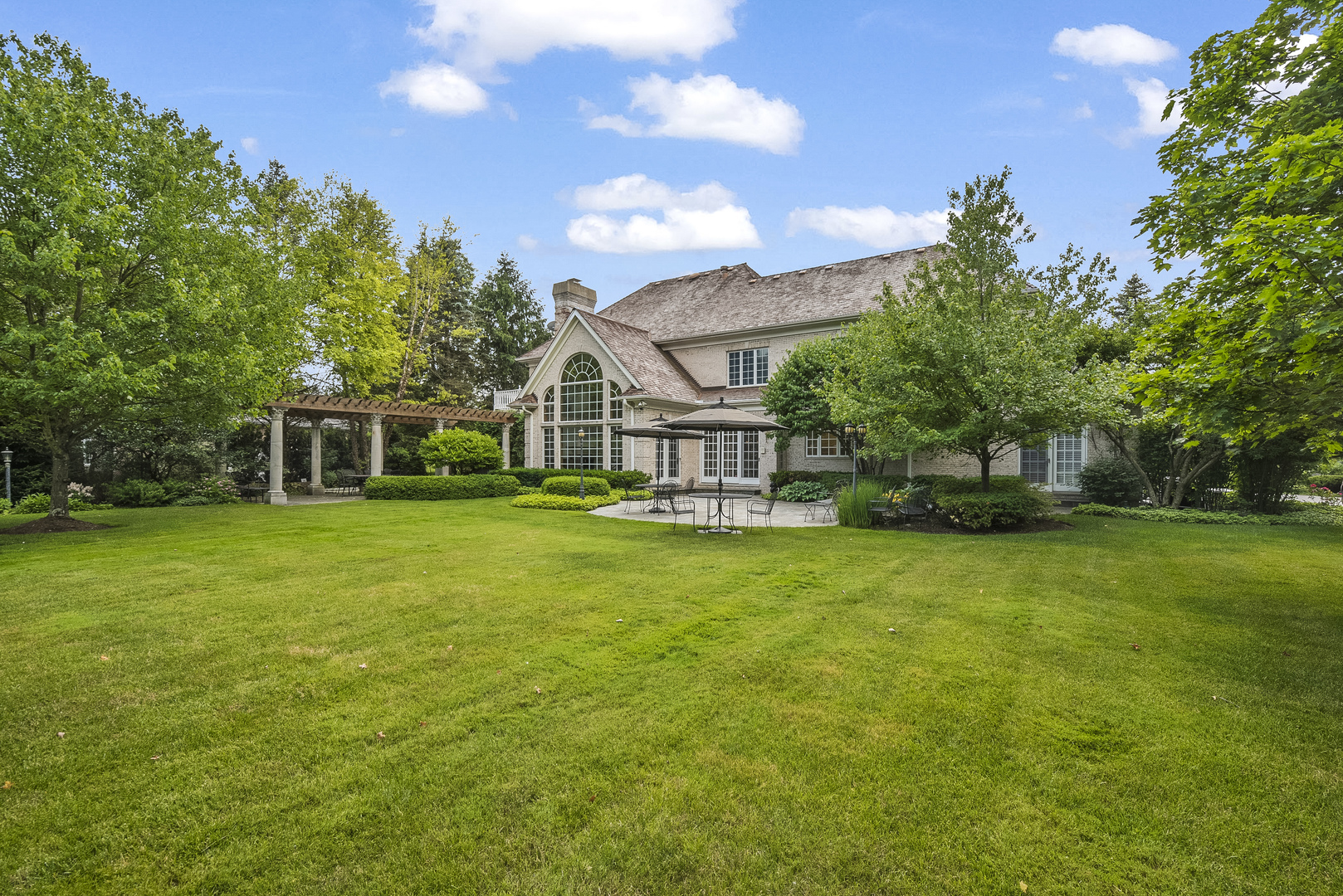 351 Wallace Road Lake Forest, IL 60045 - Photo 19 of 35 a front view of a house with a garden