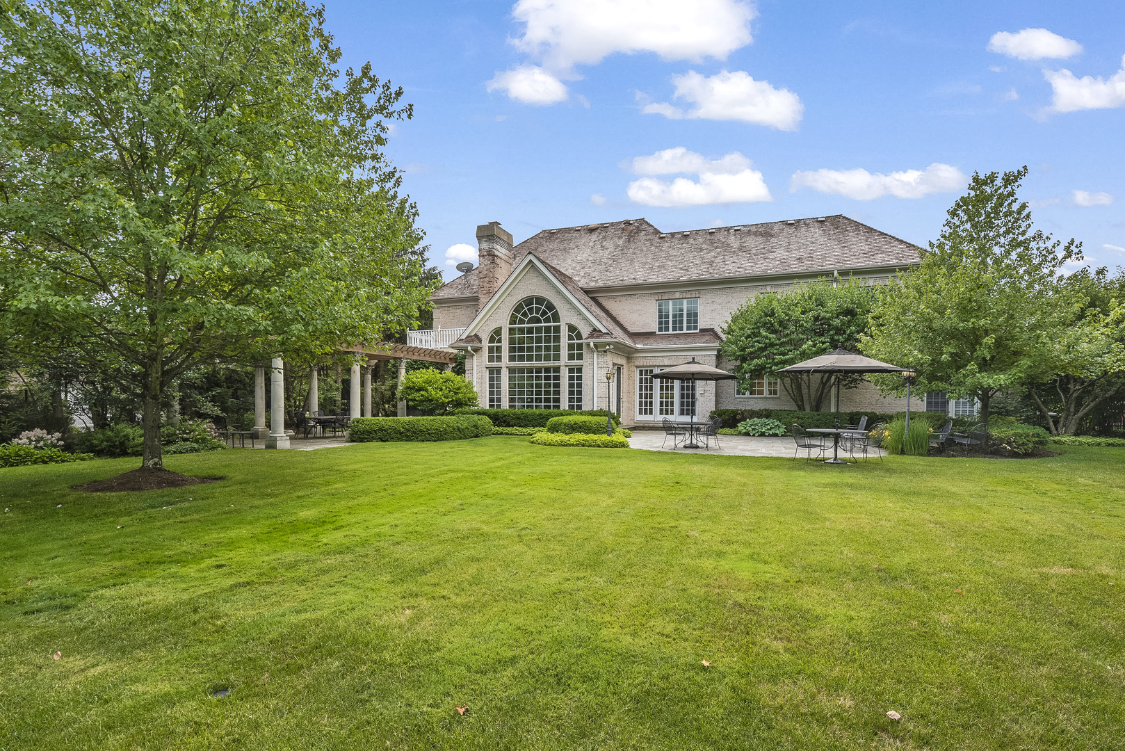 351 Wallace Road Lake Forest, IL 60045 - Photo 20 of 35 a front view of a house with a garden