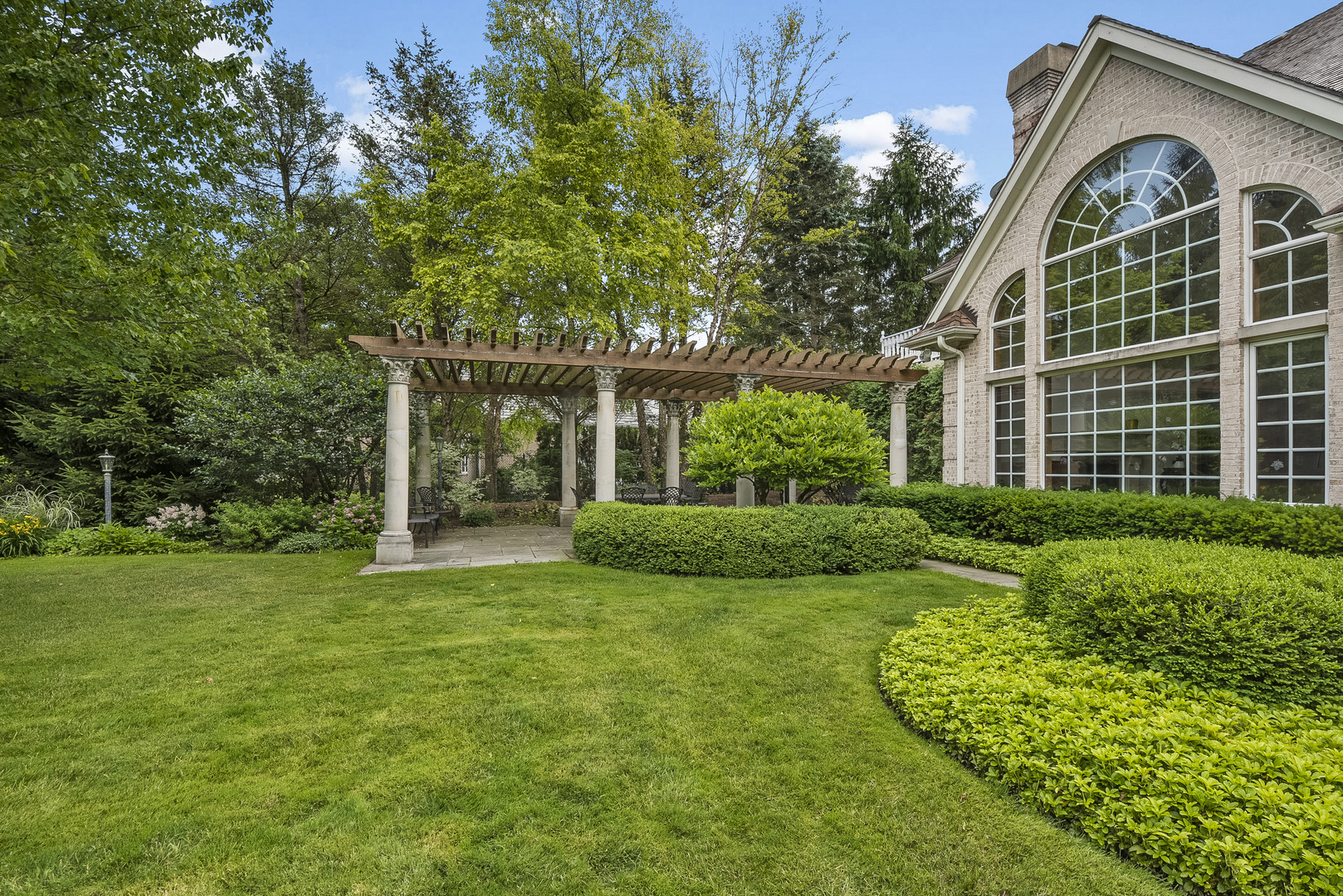 351 Wallace Road Lake Forest, IL 60045 - Photo 3 of 35 a view of a house with a yard and sitting area