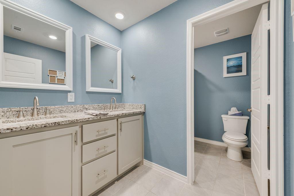 628 Bunker Hl Road Fate, TX 75189 - Photo 22 of 38 Double sinks and granite counters - high-end upgrade, Framed mirrors and recessed lighting.