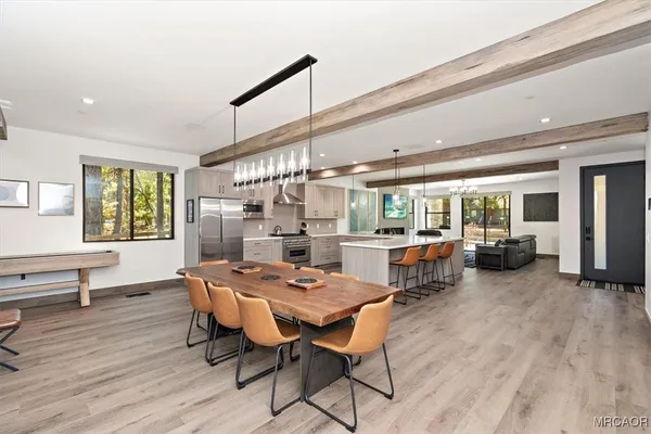 a outdoor space with a large window and furniture