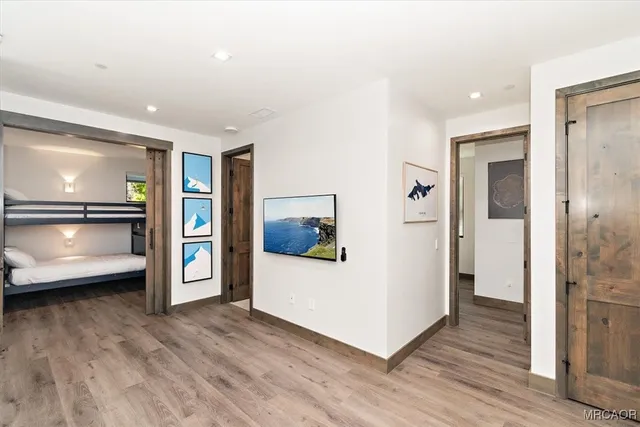 a view of a living room and a wooden floor