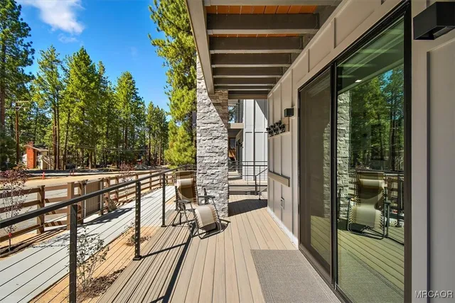a view of balcony and wooden floor