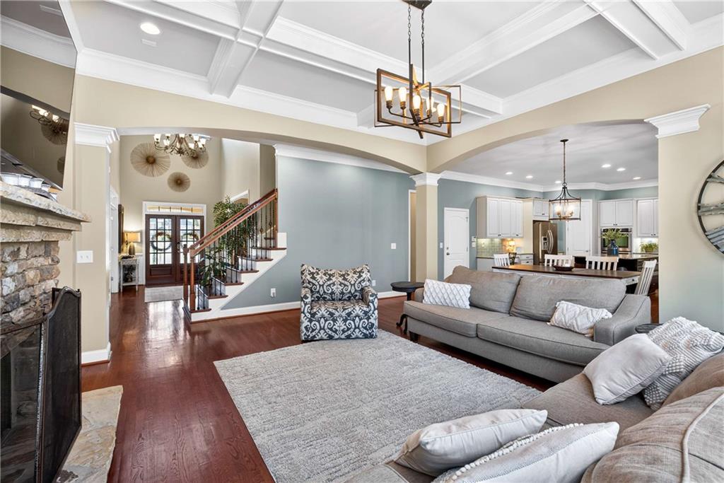 340 Scott Farm Drive Powder Springs, GA 30127 - Photo 12 of 59 a living room with furniture and a chandelier