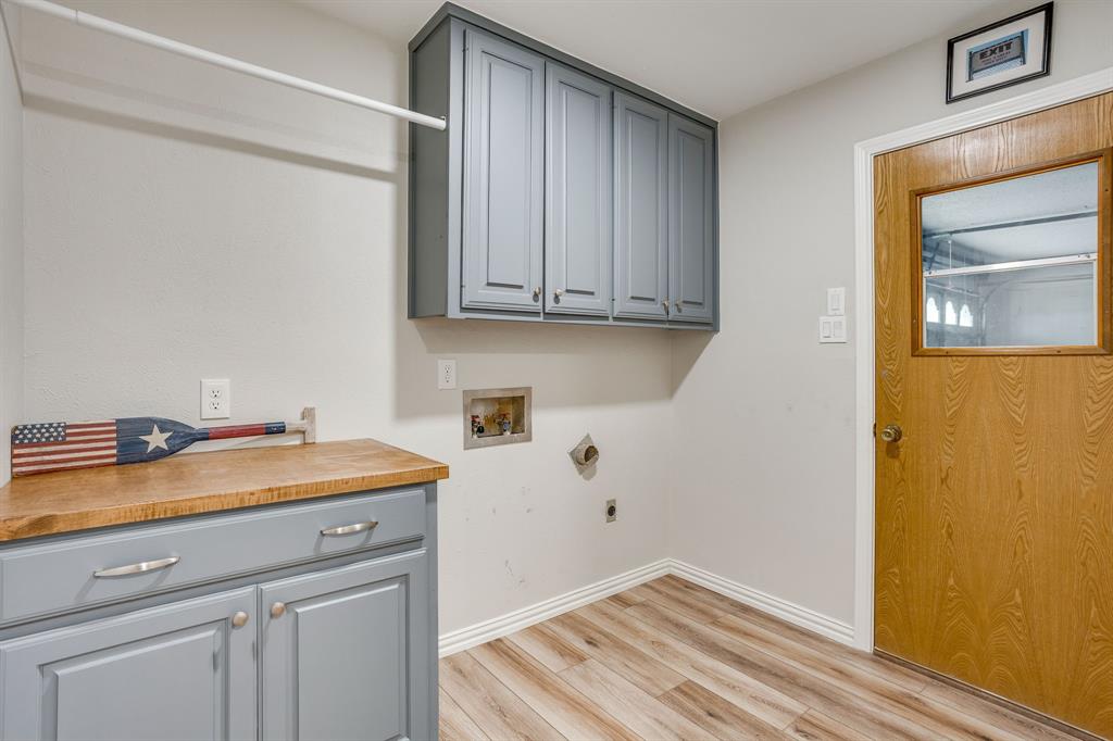 10814 Power Squadron Road Azle, TX 76020 - Photo 11 of 34 a utility room with a sink dryer and washer