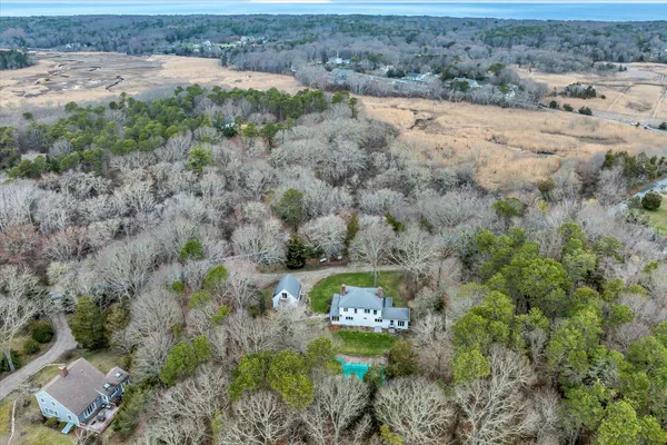 an aerial view of mountain with yard
