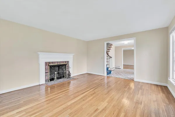 a kitchen with stainless steel appliances granite countertop a stove a kitchen island a dining table and chairs