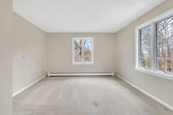 a view of a kitchen cabinets and a wooden floor