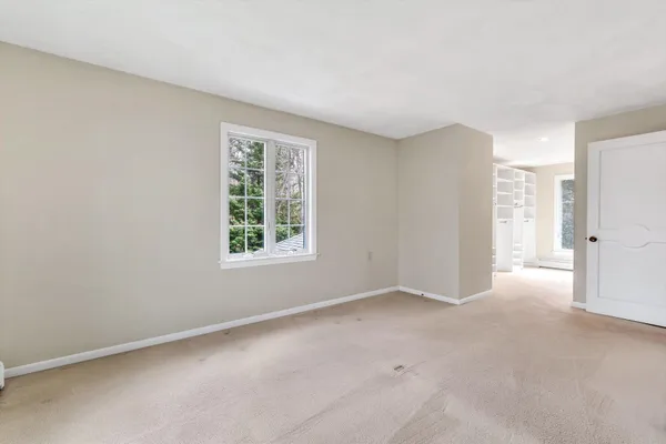 a bathroom with a bathtub and a mirror