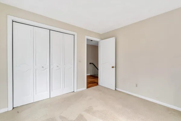 a view of room with wooden floor