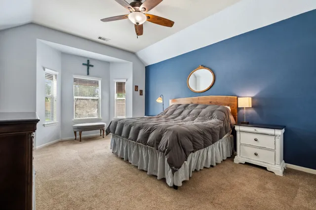 a bedroom with a bed and window