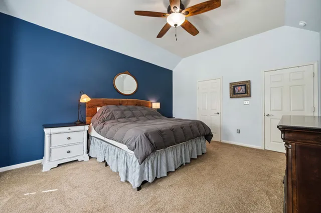 a bedroom with a bed and cabinets