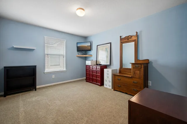 a room with furniture and a flat screen tv