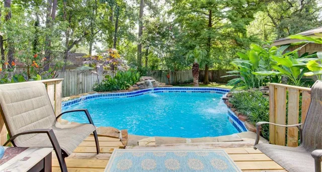 a view of a backyard with sitting area