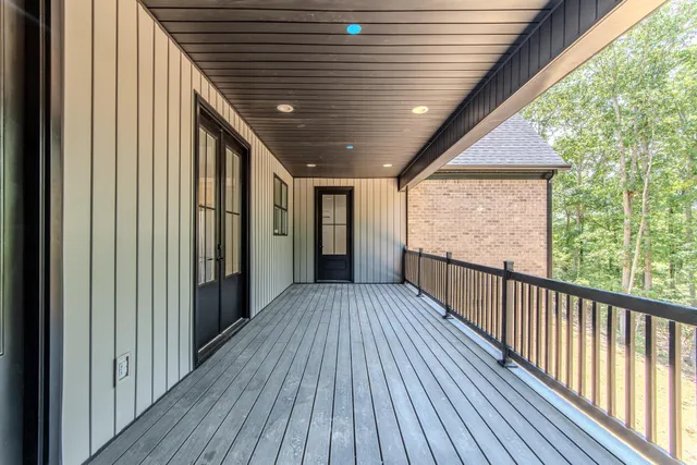 a view of a balcony with wooden floor
