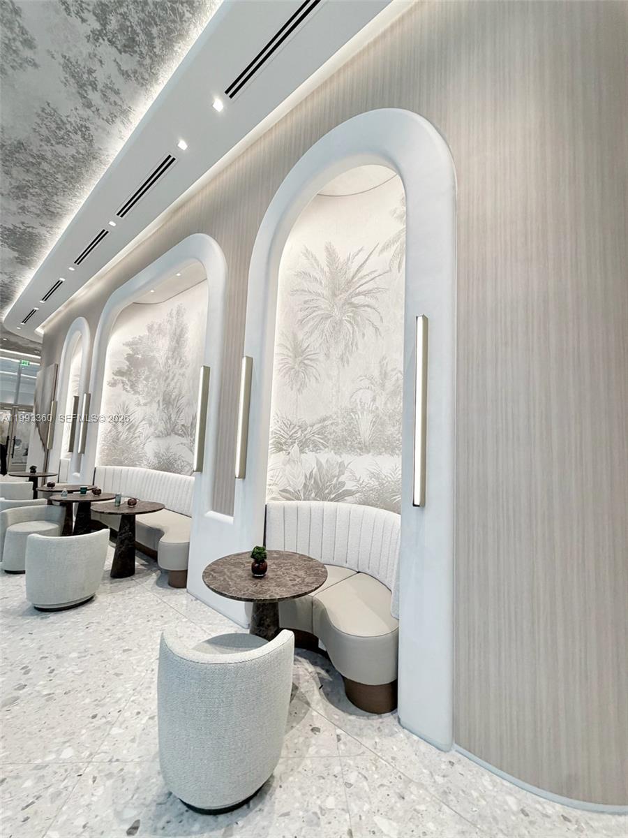 77 Southeast 5th Street, Unit 1608 Miami, FL 33131 - Photo 18 of 44 a living room with furniture and a large window