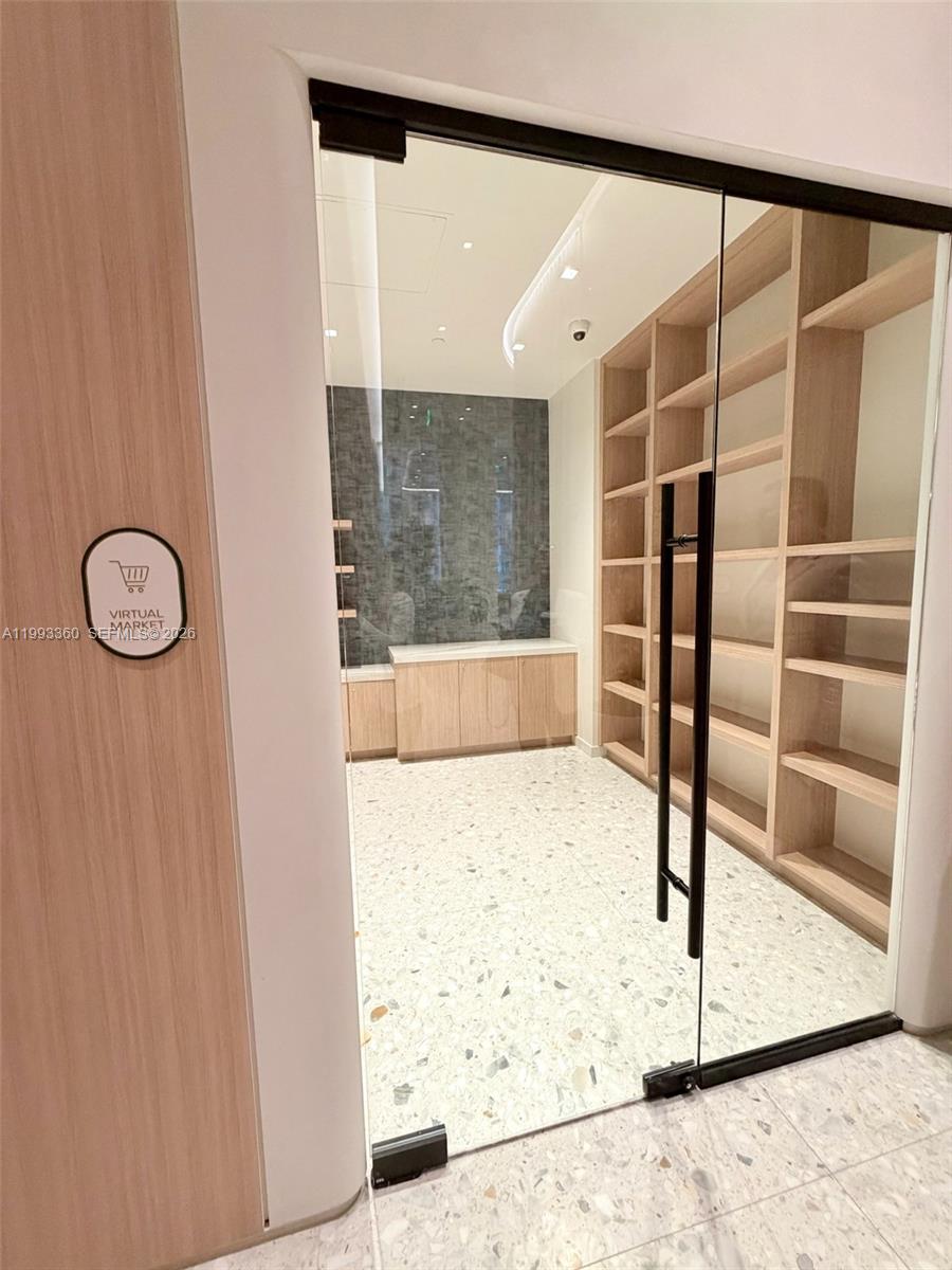 77 Southeast 5th Street, Unit 1608 Miami, FL 33131 - Photo 23 of 44 view of wooden floor and windows in a room