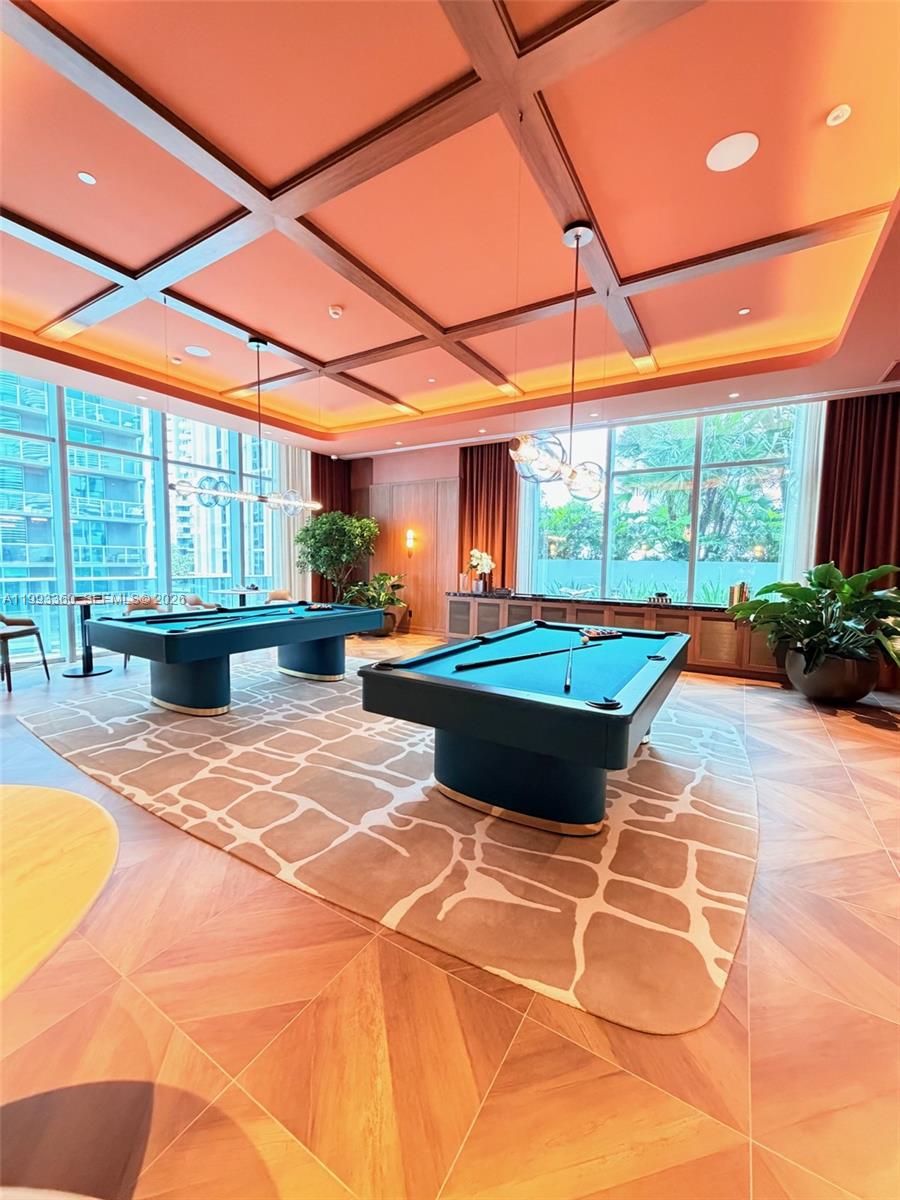 77 Southeast 5th Street, Unit 1608 Miami, FL 33131 - Photo 24 of 44 a building outdoor space with patio furniture and garden