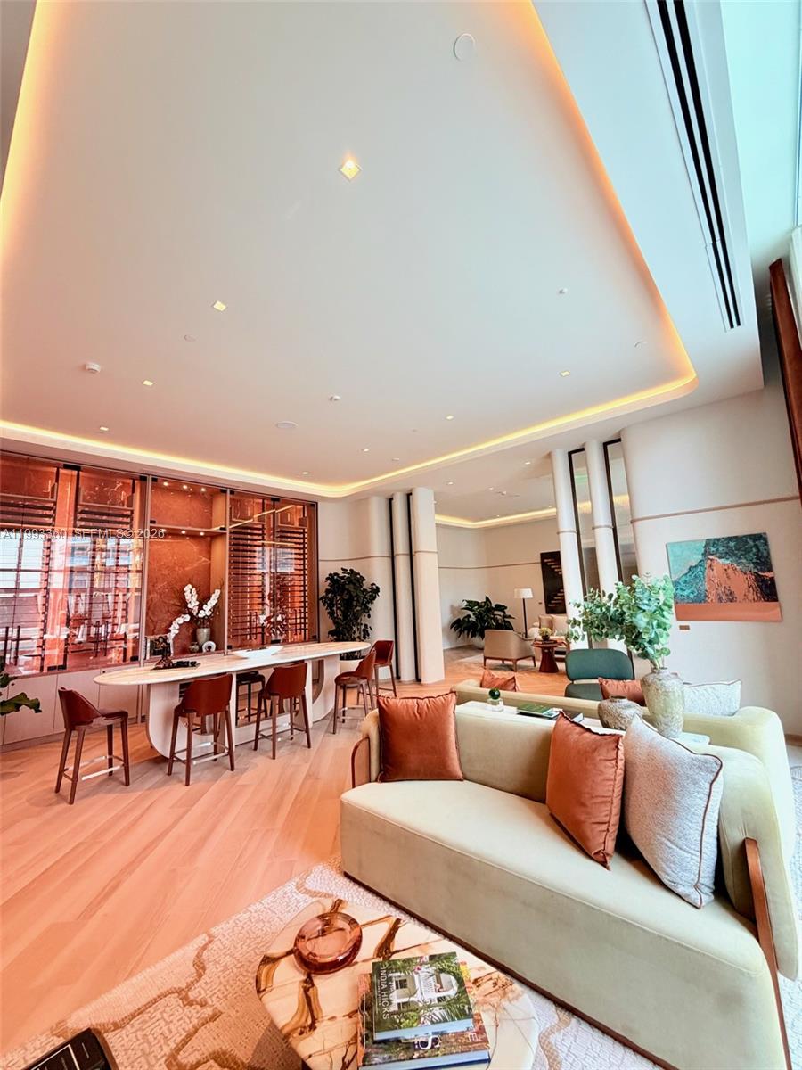 77 Southeast 5th Street, Unit 1608 Miami, FL 33131 - Photo 34 of 44 a living room with furniture and a large window