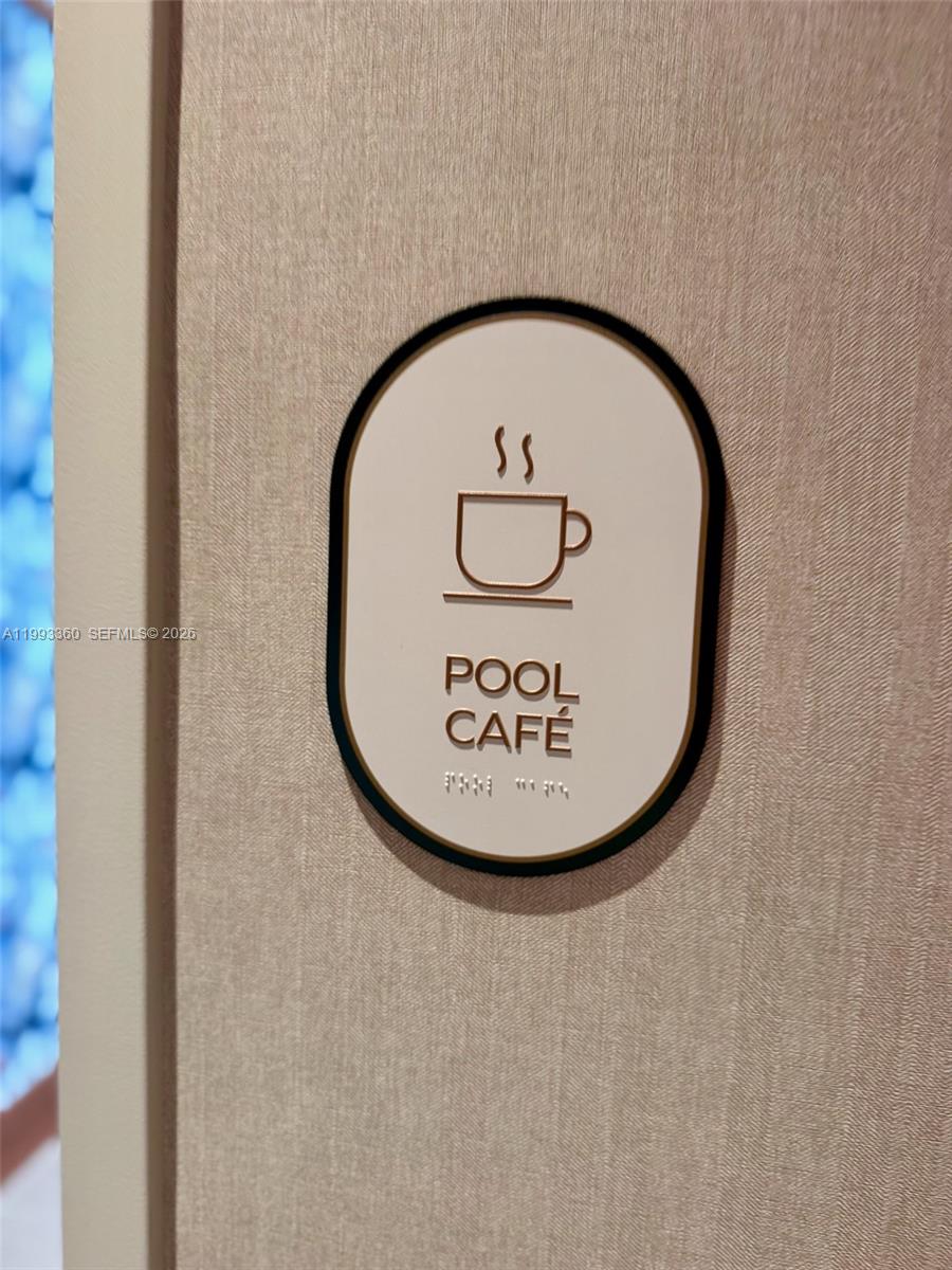 77 Southeast 5th Street, Unit 1608 Miami, FL 33131 - Photo 37 of 44 a view of staircase with a metal door