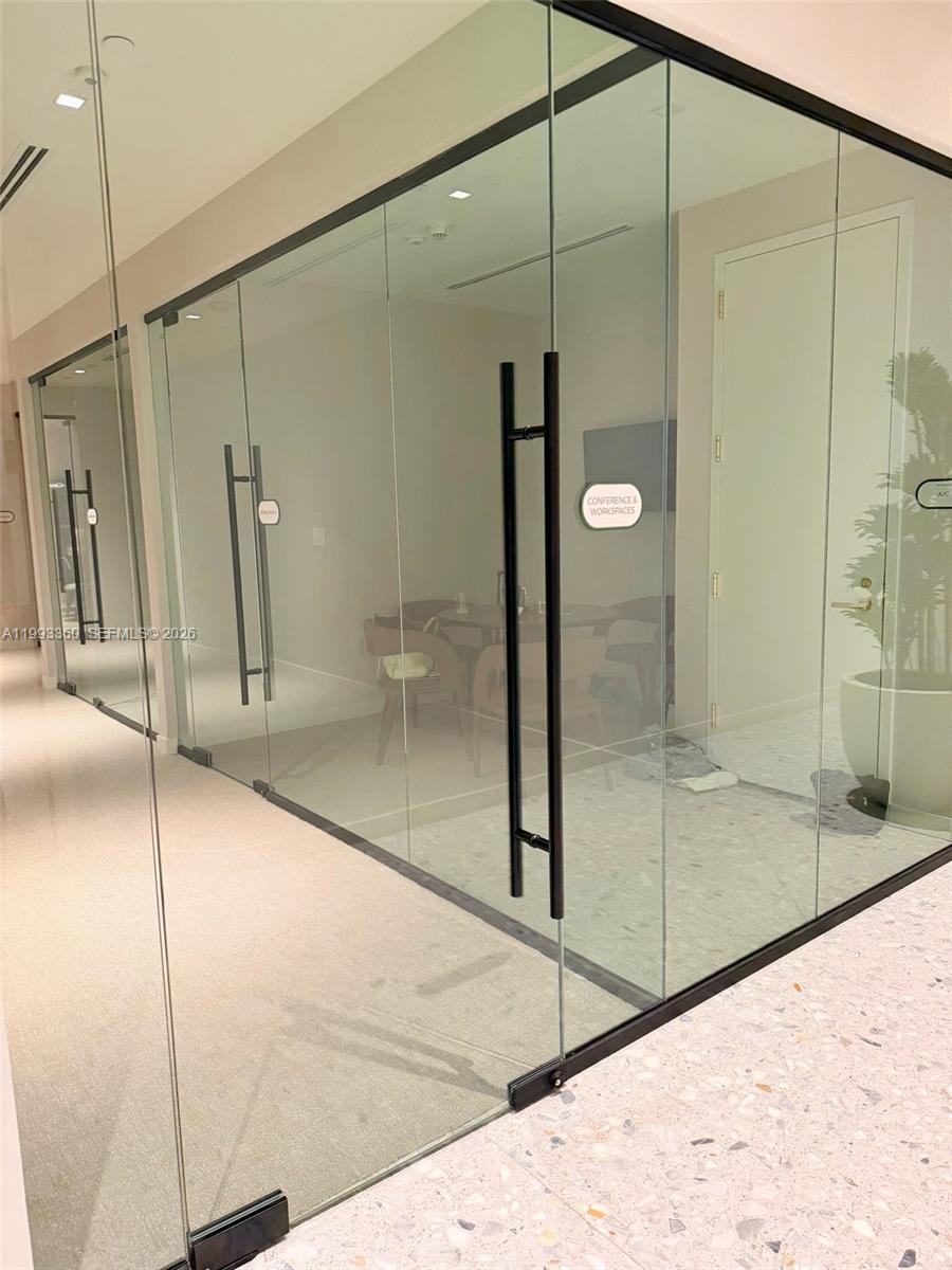 77 Southeast 5th Street, Unit 1608 Miami, FL 33131 - Photo 43 of 44 a bathroom with a shower and a sink