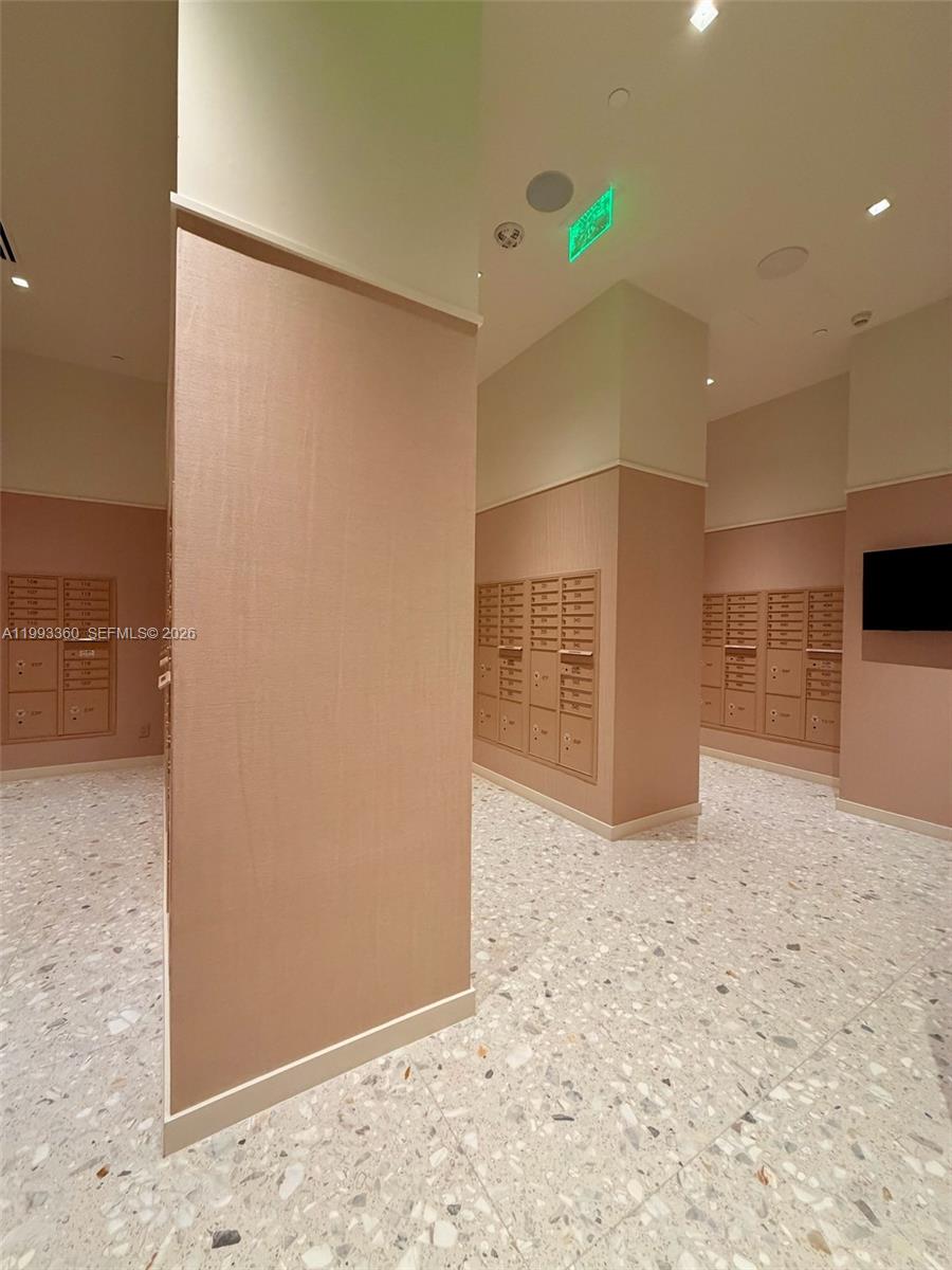 77 Southeast 5th Street, Unit 1608 Miami, FL 33131 - Photo 44 of 44 a view of kitchen with refrigerator and wooden floor