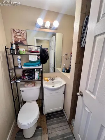 a view of a backyard with chair and a fire pit