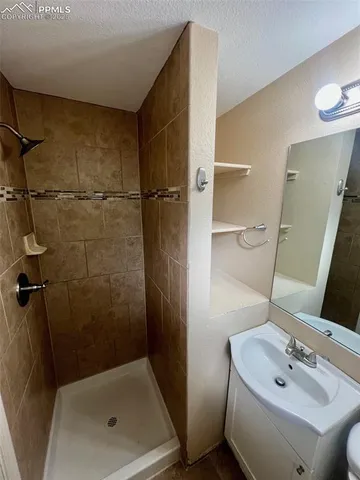 a bathroom with a sink and mirror