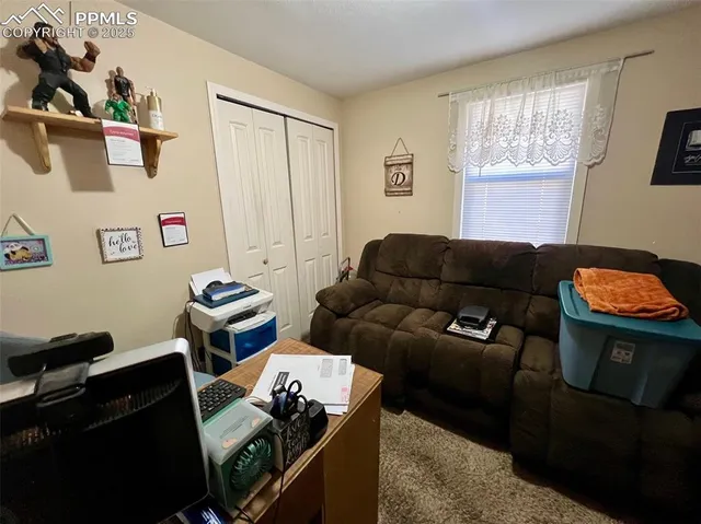 a room with furniture and flat screen tv