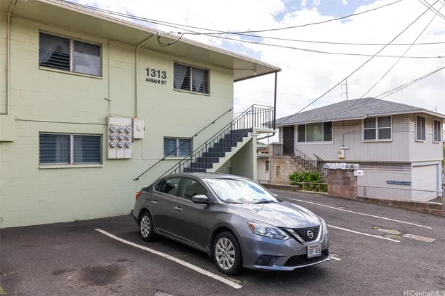 a car parked in front of a house