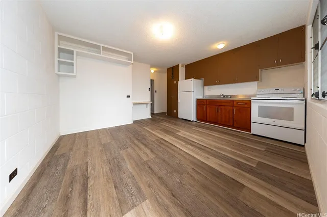 a view of a kitchen with wooden floor