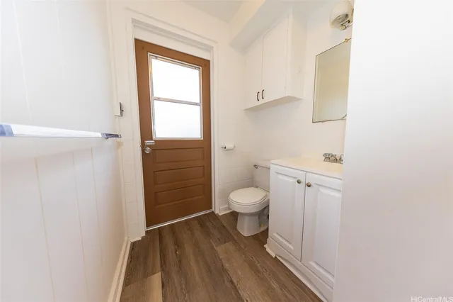 a bathroom with a toilet sink and a shower