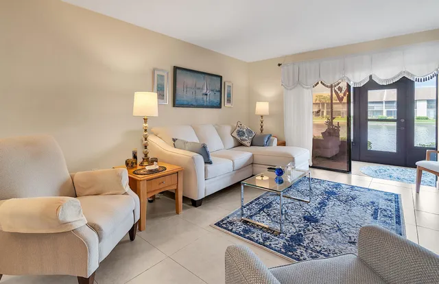 a bathroom with a sink mirror and a shower curtain