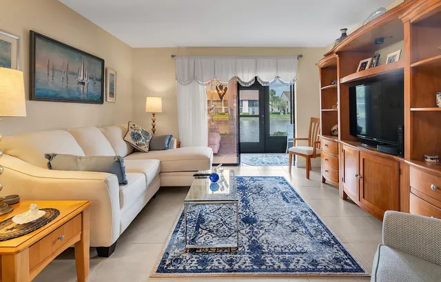 a living room with a large window and table