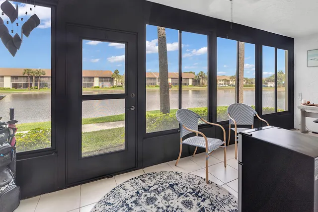 a living room with large windows