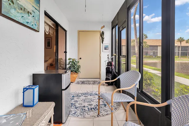 a view of a lake with houses in the back