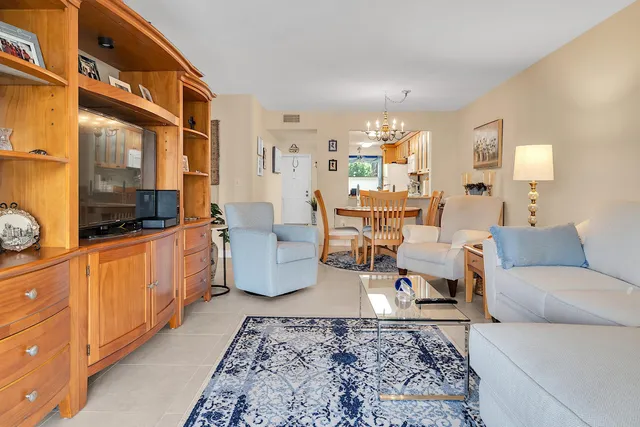 a bedroom with a bed and a television