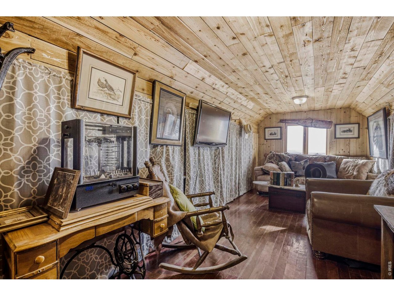1042 Steamboat Valley Road Lyons, CO 80540 - Photo 12 of 46 West Wing - Above the Primary Suit and Office Den, a secrete cedar wall/wood floor studio/man cave. TONS of behind the wall storage here.