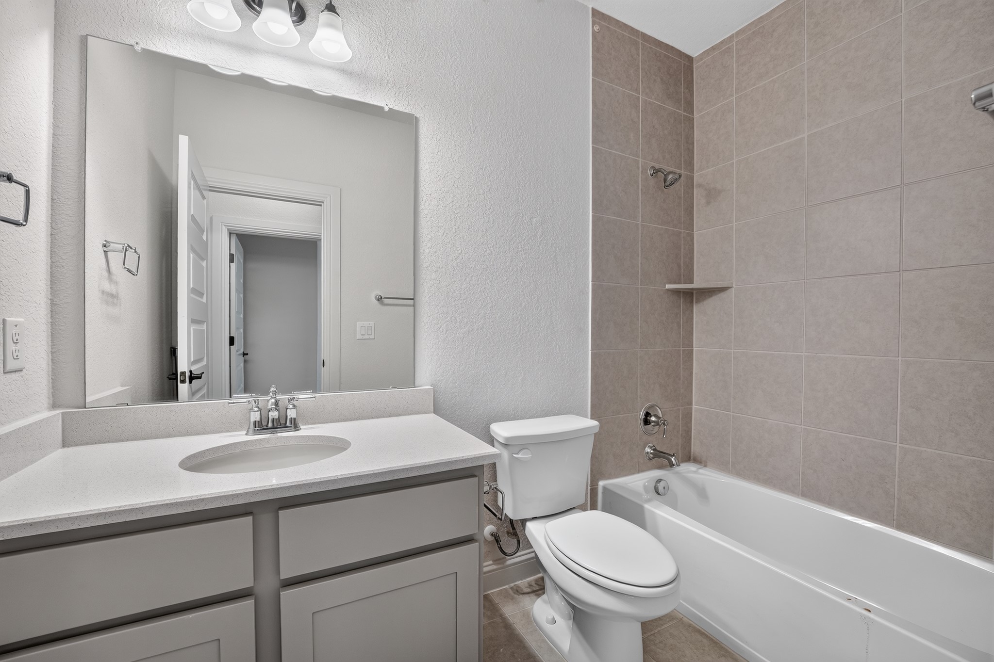 508 Pinnacle View Drive Georgetown, TX 78628 - Photo 18 of 27 A well-appointed bathroom features a single vanity and a tiled bath with a built-in shelf.