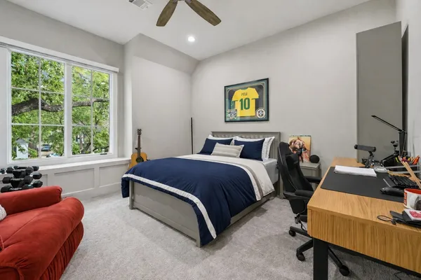 a bedroom with a bed and a couch